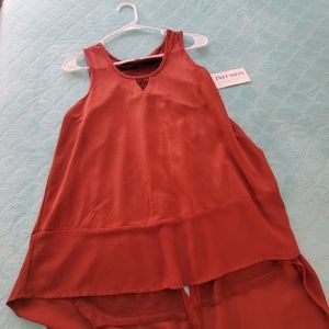 Faux suede sleeve less top.